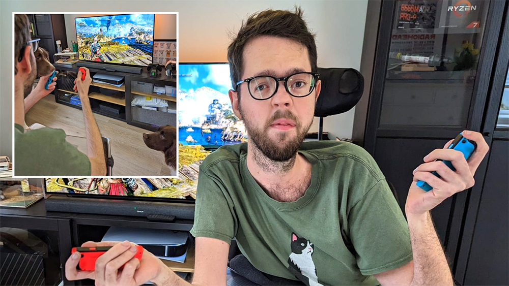 Man in front of gaming screen holding a joy-con in each hand